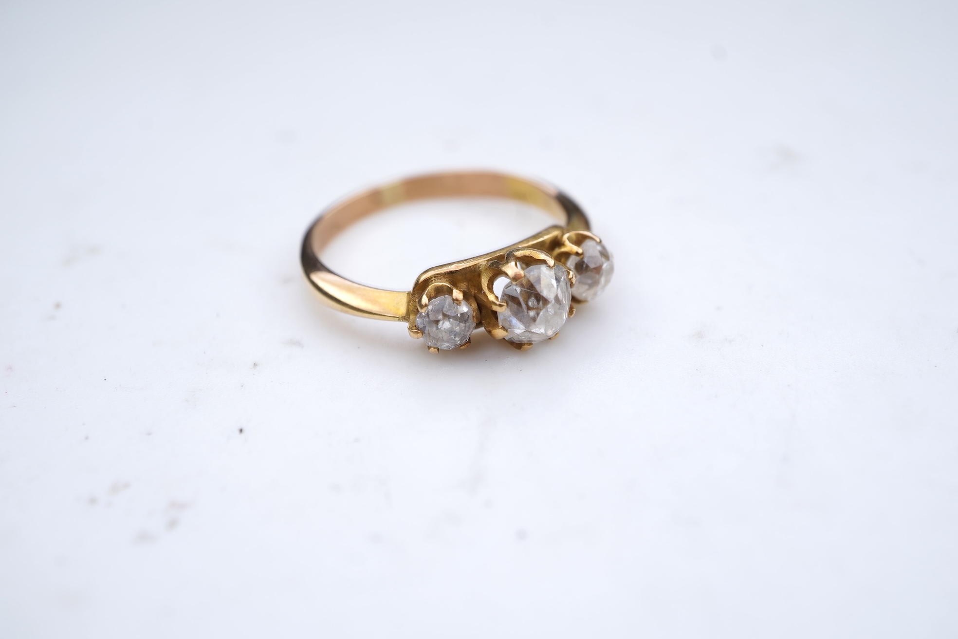 A three-stone diamond ring, early 20th century